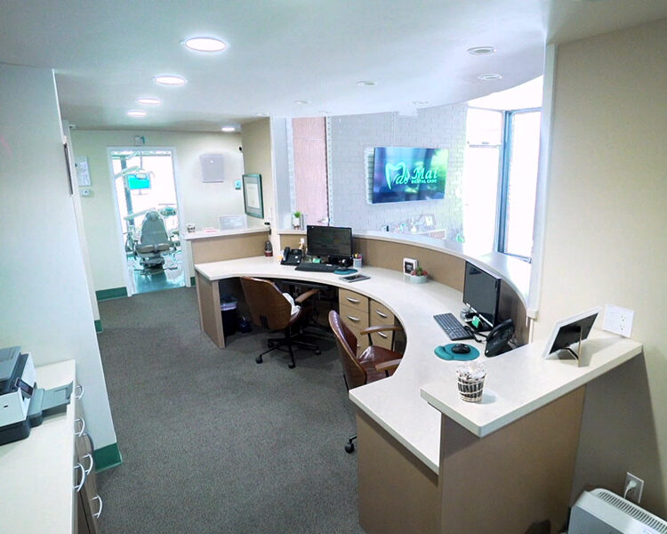 Interior view of the patient reception and check-in desk at Mai Dental Care.